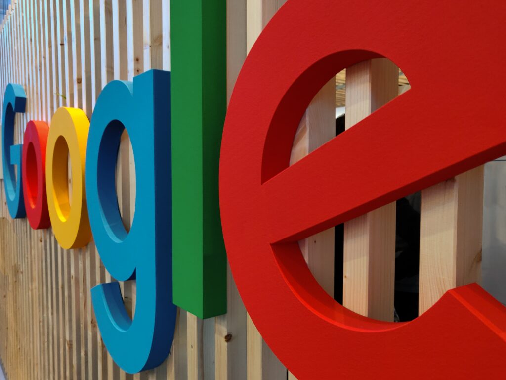 Google Colorful Logo on Wood Background