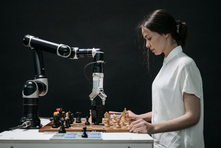 Girl playing with Chess robot